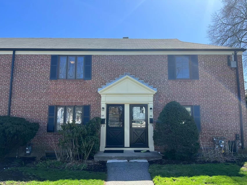92 Duff Street Watertown, MA 02472 - Photo 12 of 18 a front view of a house with garden