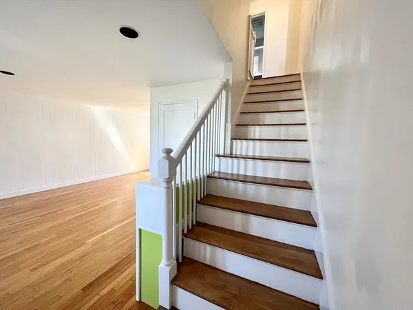 a view of entryway with wooden floor