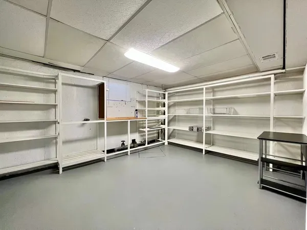a view of an empty room with shelves