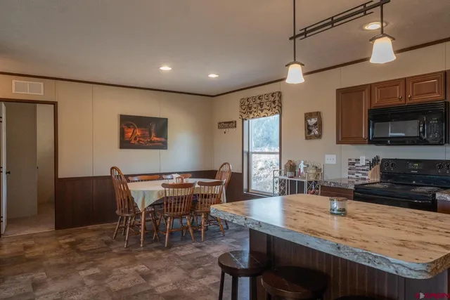 a view of a dining room with furniture