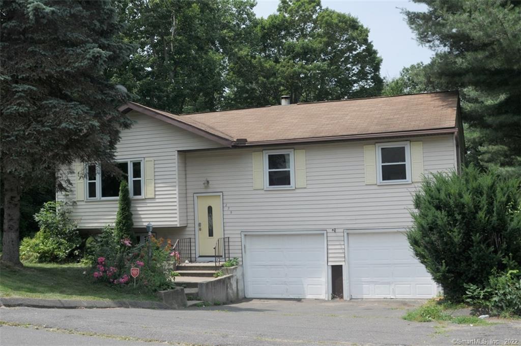 239 Andrews Road Wolcott, CT 06716 - Photo 1 of 1 a front view of a house with a garden