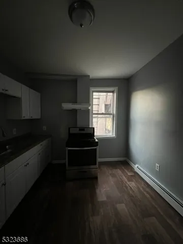 a kitchen with sink and window