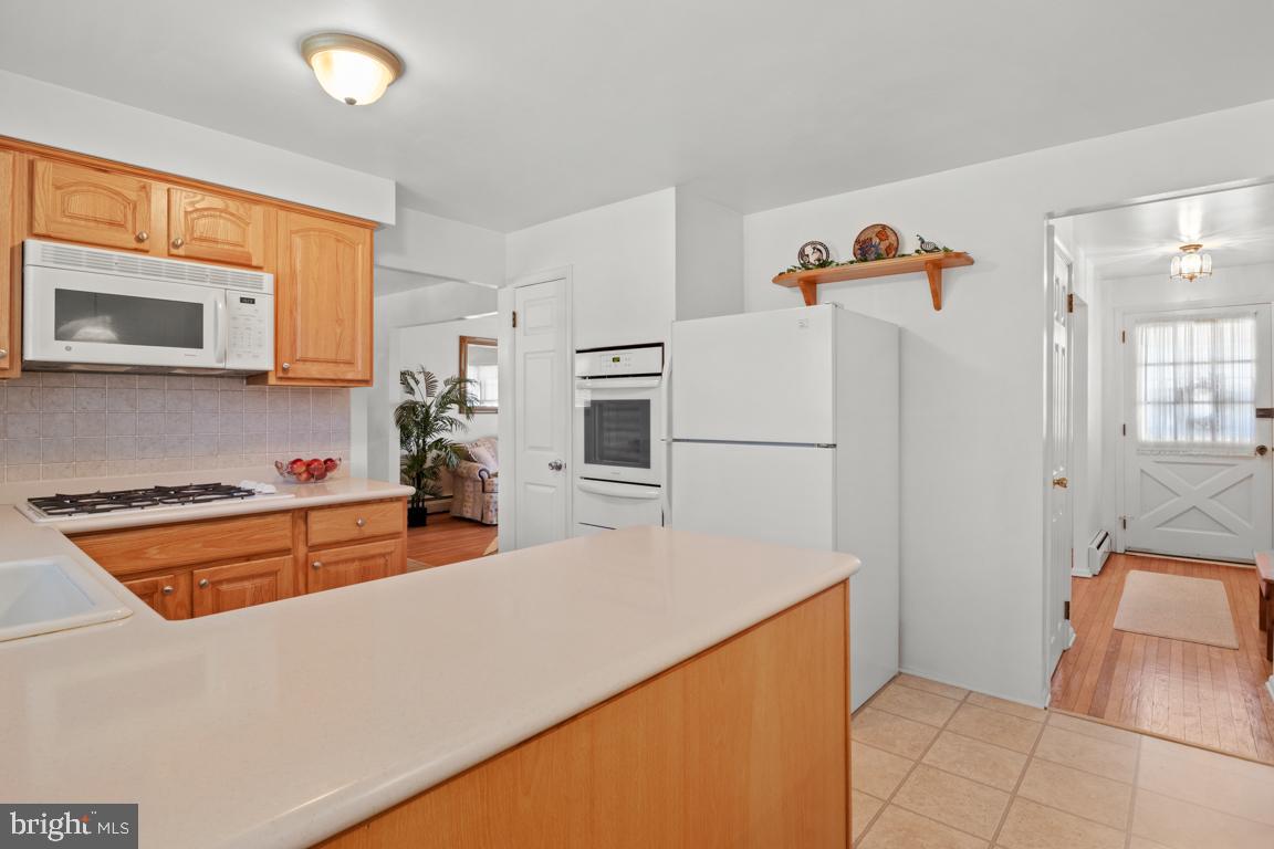 1538 Windmill Road Warminster, PA 18974 - Photo 14 of 32 a kitchen with stainless steel appliances granite countertop a refrigerator and a stove top oven