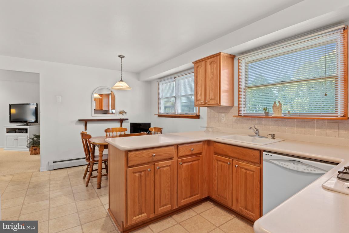 1538 Windmill Road Warminster, PA 18974 - Photo 15 of 32 a kitchen with a sink window and cabinets