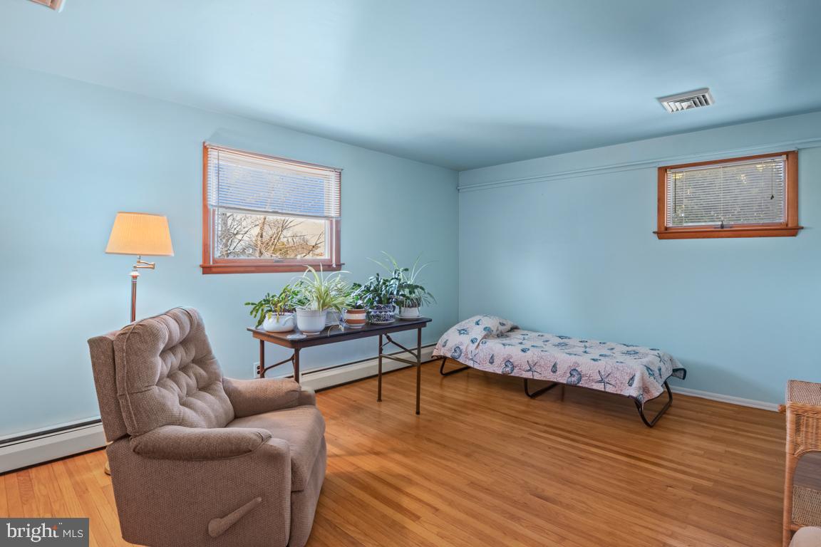 1538 Windmill Road Warminster, PA 18974 - Photo 21 of 32 a bedroom with furniture and a wooden floor