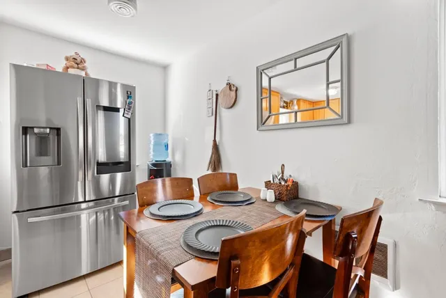 a table and chairs in a kitchen