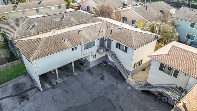 a aerial view of a house with a yard