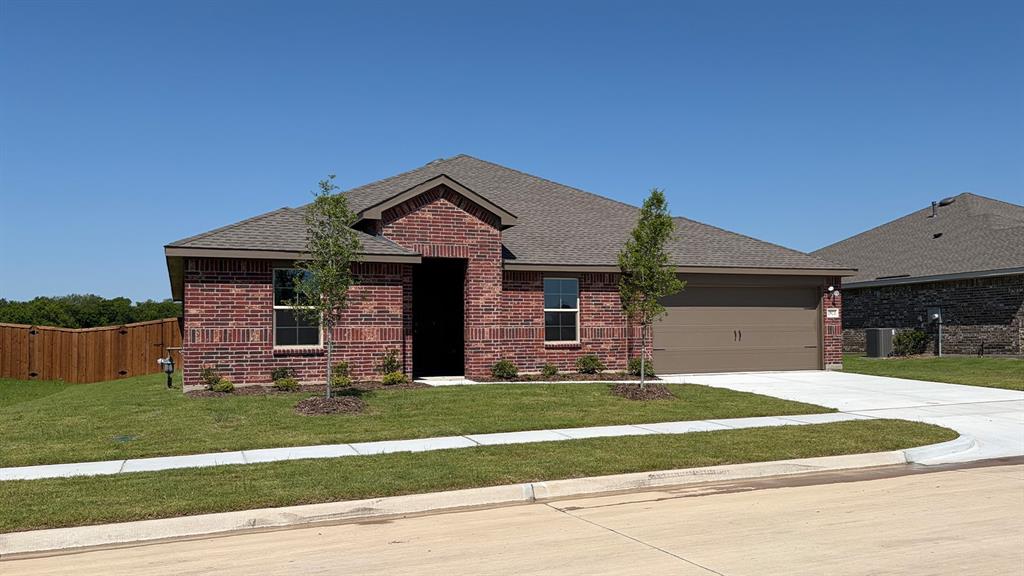 1921 Reveille Way Terrell, TX 75160 - Photo 25 of 30 a front view of a house with a yard