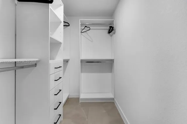 wooden view of walk in closet