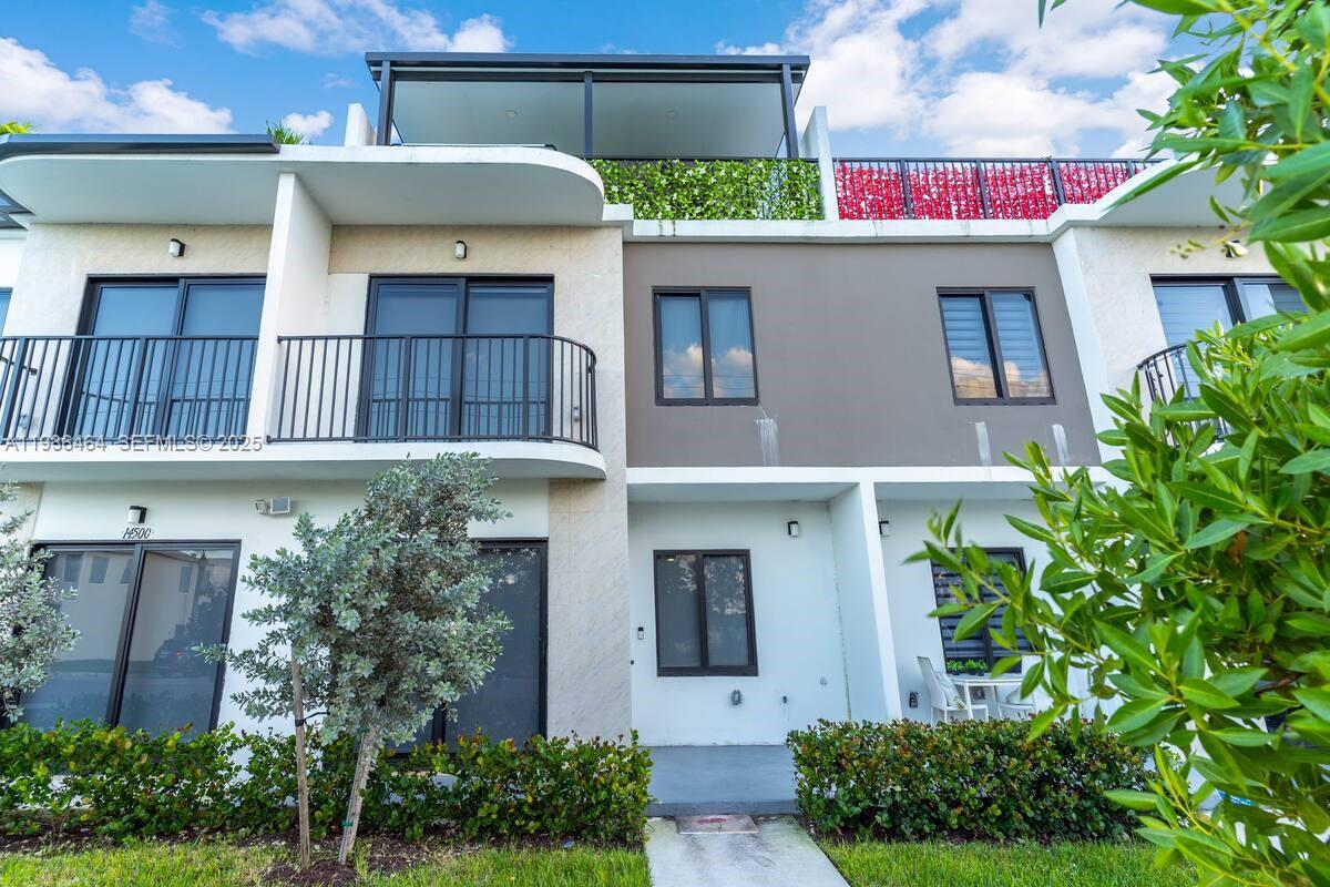 14502 Southwest 260th Street Homestead, FL 33032 - Photo 8 of 8 a front view of a house with plants