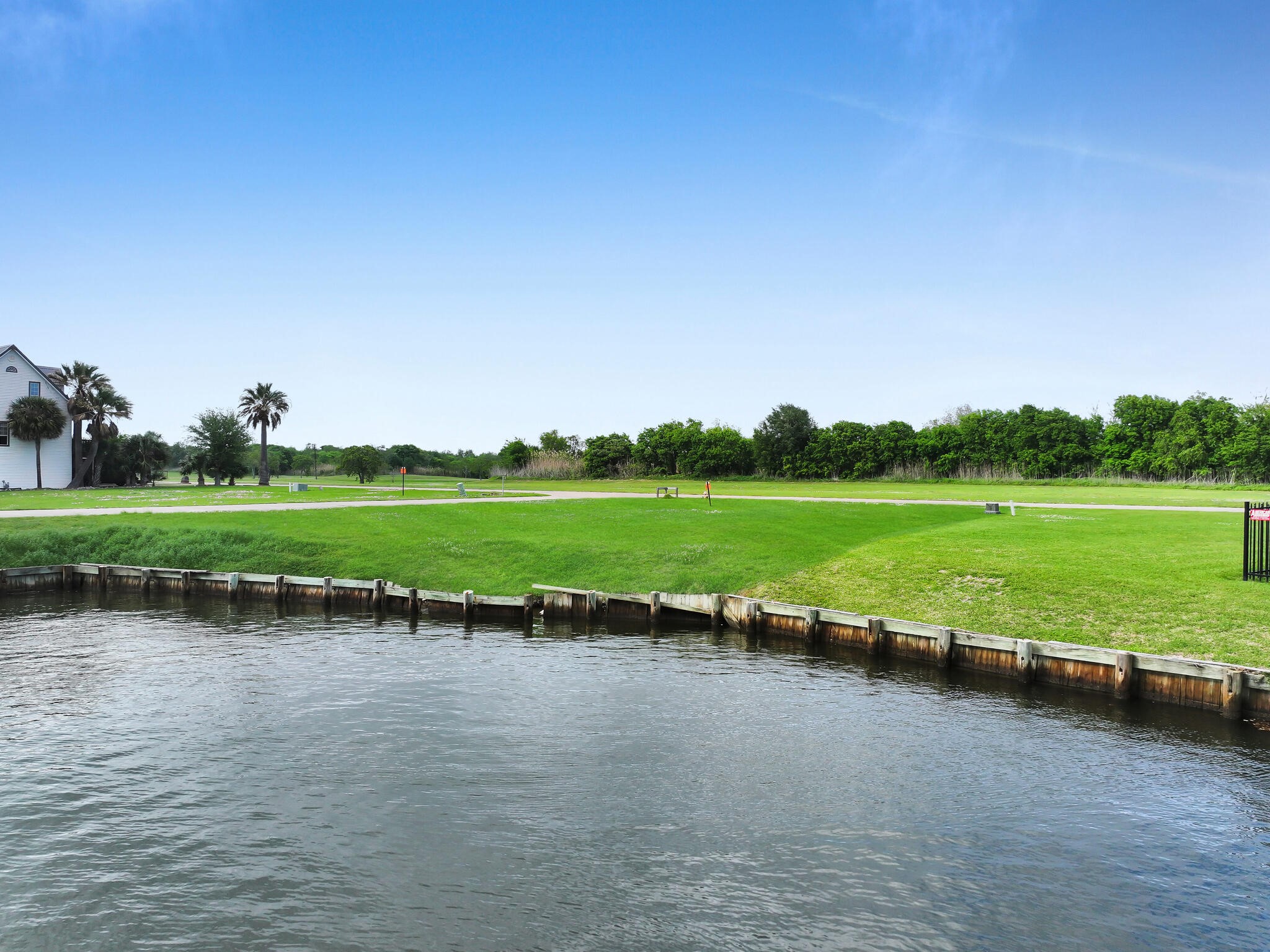 501 Southwind Port Arthur, TX 77640 - Photo 22 of 33 a view of a lake with a big yard