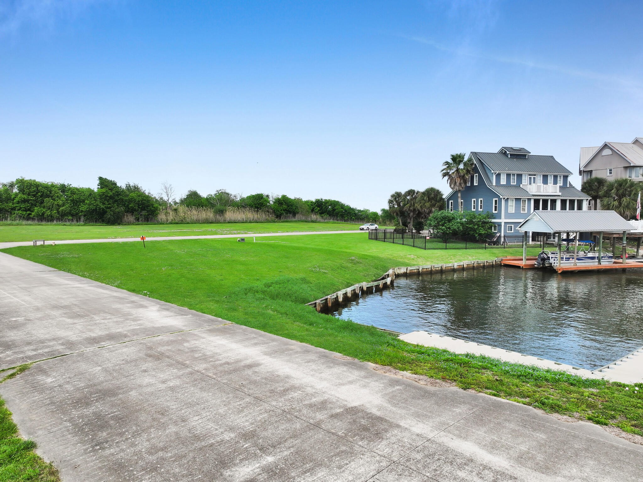 501 Southwind Port Arthur, TX 77640 - Photo 23 of 33 a view of a lake with houses in the back