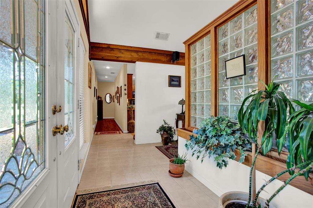 7146 Refuge Road Pottsboro, TX 75076 - Photo 29 of 39 a view of potted plants in front of a glass door