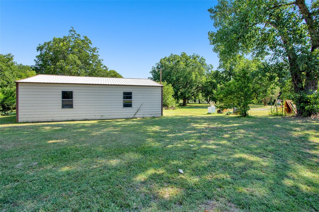 7146 Refuge Road Pottsboro, TX 75076 - Photo 8 of 39 a house view with a garden space