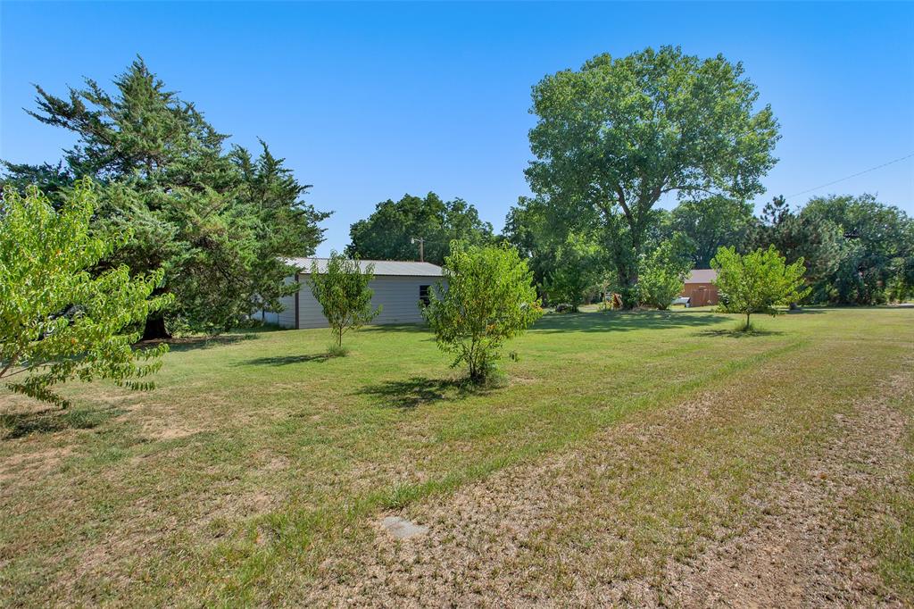 7146 Refuge Road Pottsboro, TX 75076 - Photo 9 of 39 a front view of a house with a yard