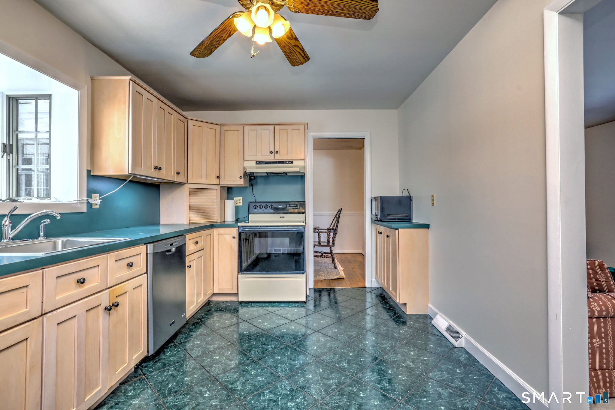 30 Crestview Terrace Wallingford, CT 06492 - Photo 12 of 32 a kitchen with cabinets and window