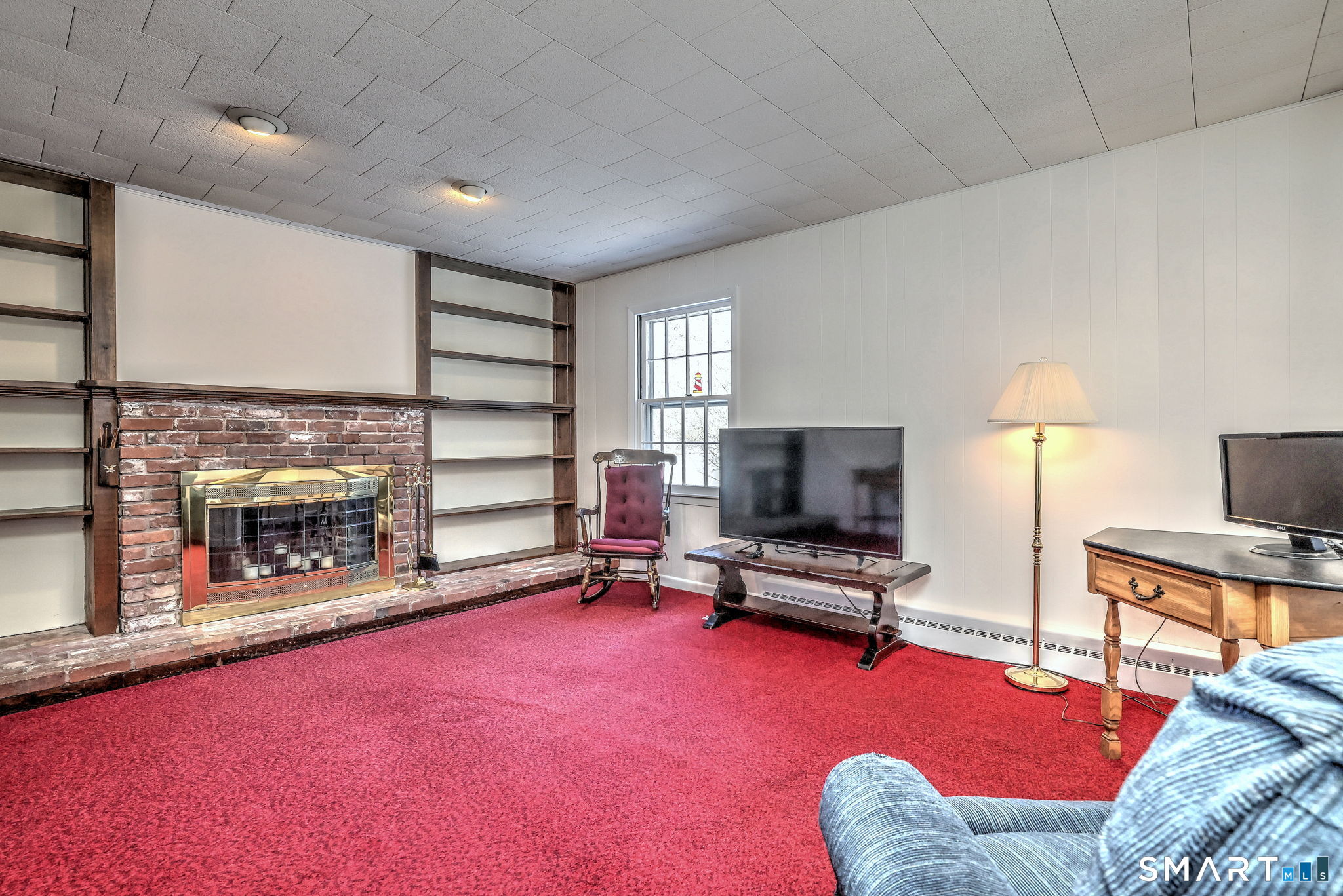 30 Crestview Terrace Wallingford, CT 06492 - Photo 13 of 32 a livingroom with furniture a fireplace and a flat screen tv