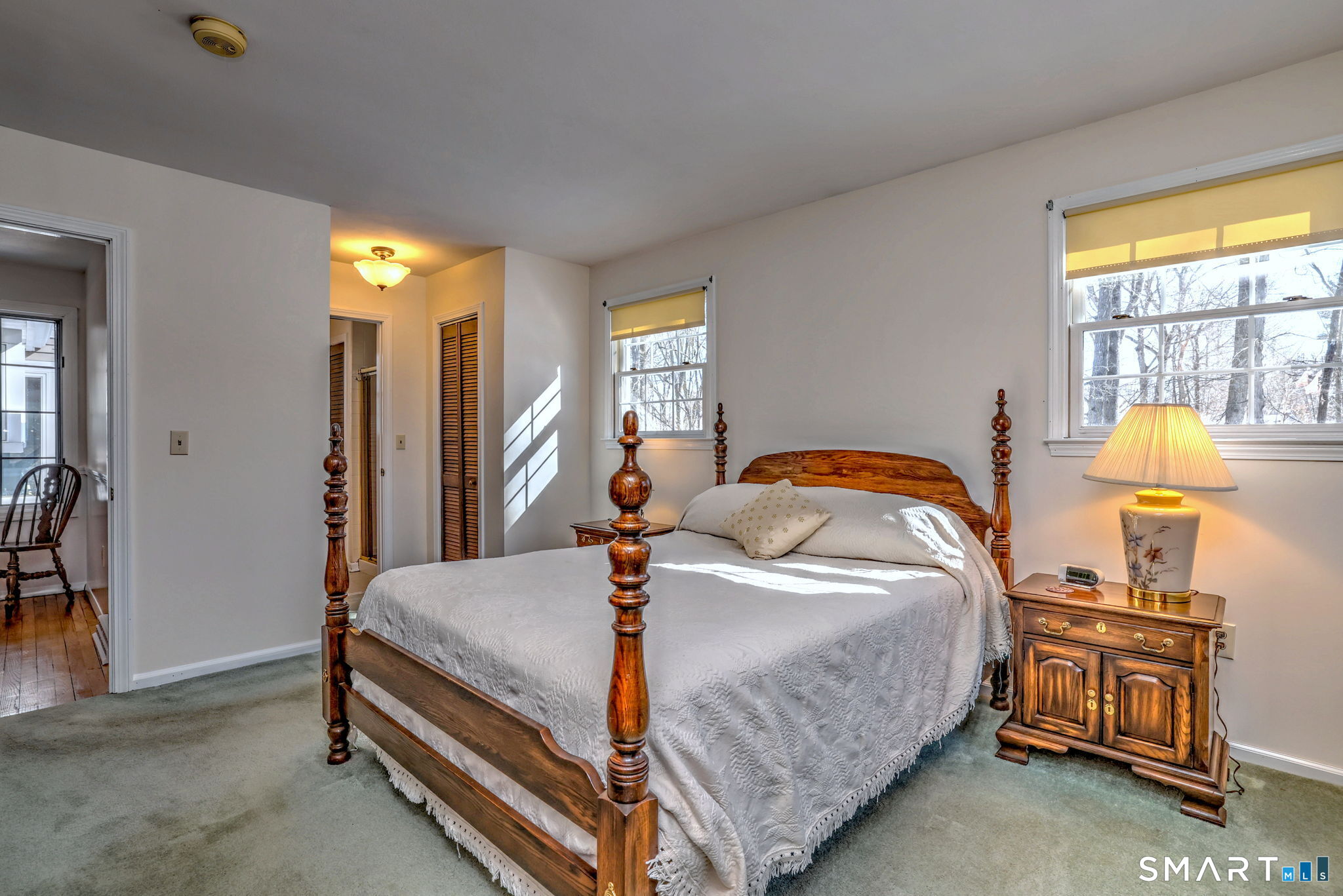 30 Crestview Terrace Wallingford, CT 06492 - Photo 20 of 32 a bedroom with a bed and a lamp