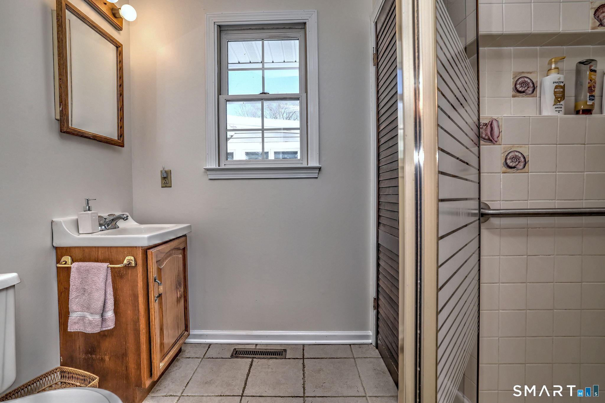 30 Crestview Terrace Wallingford, CT 06492 - Photo 22 of 32 a bathroom with mirror and window