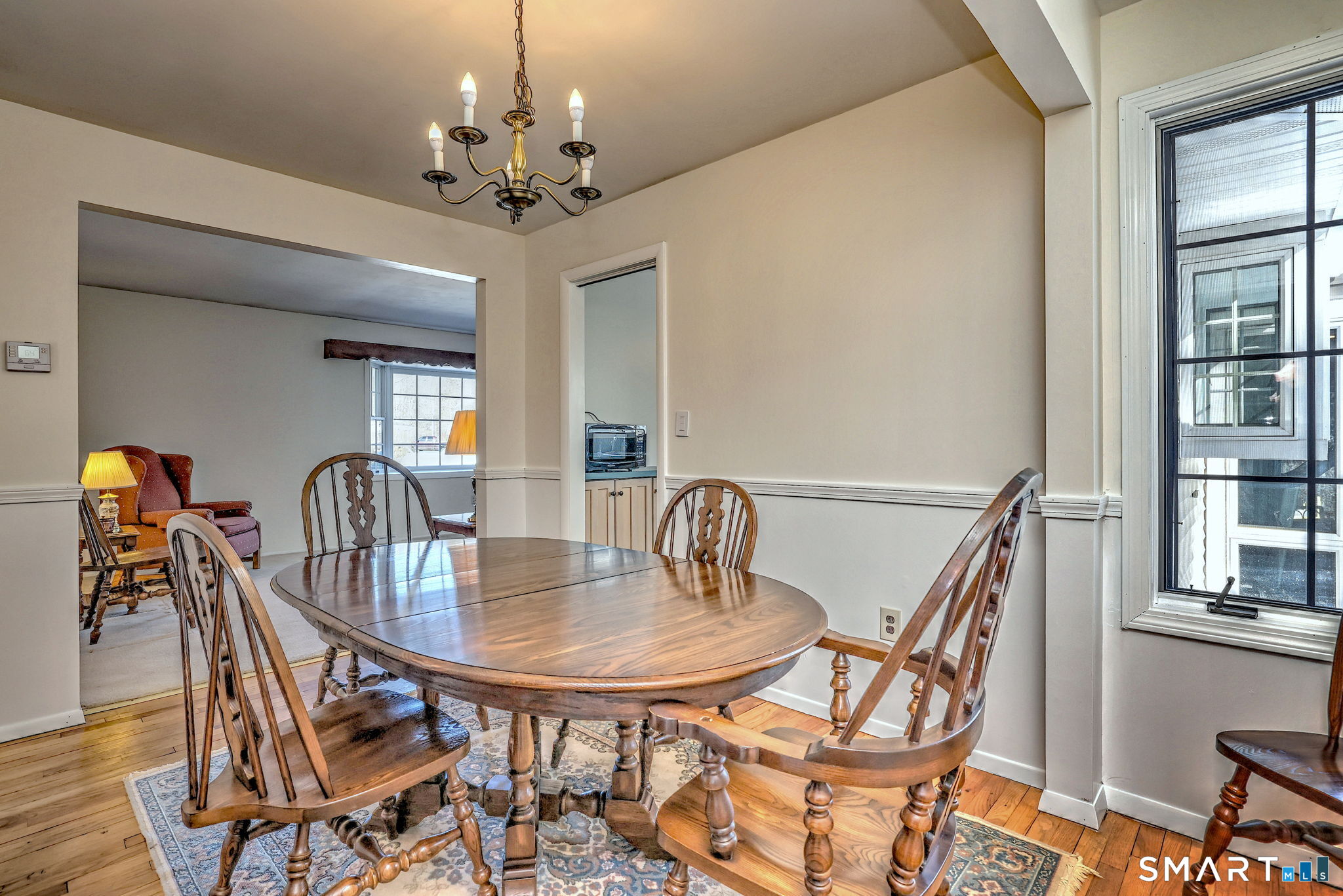 30 Crestview Terrace Wallingford, CT 06492 - Photo 3 of 32 a dining room with furniture a chandelier and wooden floor