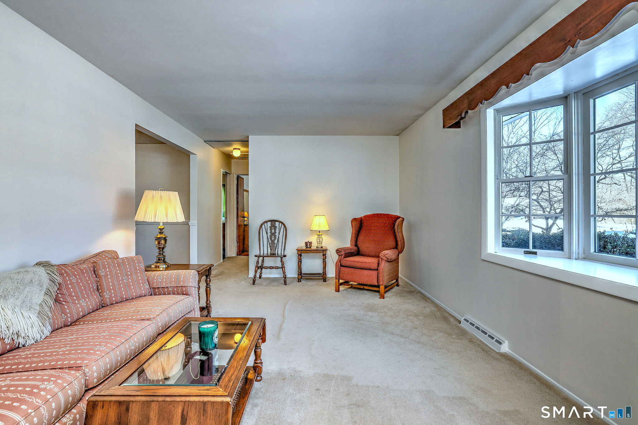 30 Crestview Terrace Wallingford, CT 06492 - Photo 9 of 32 a living room with furniture a window and a lamp