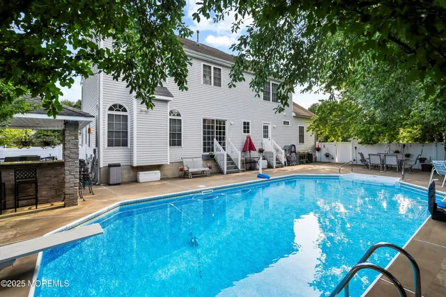 a view of a house with swimming pool