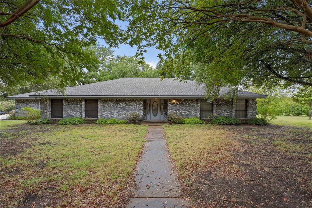 215 Lajuana Drive Waco, TX 76705 - Photo 1 of 1 a front view of a house with a garden