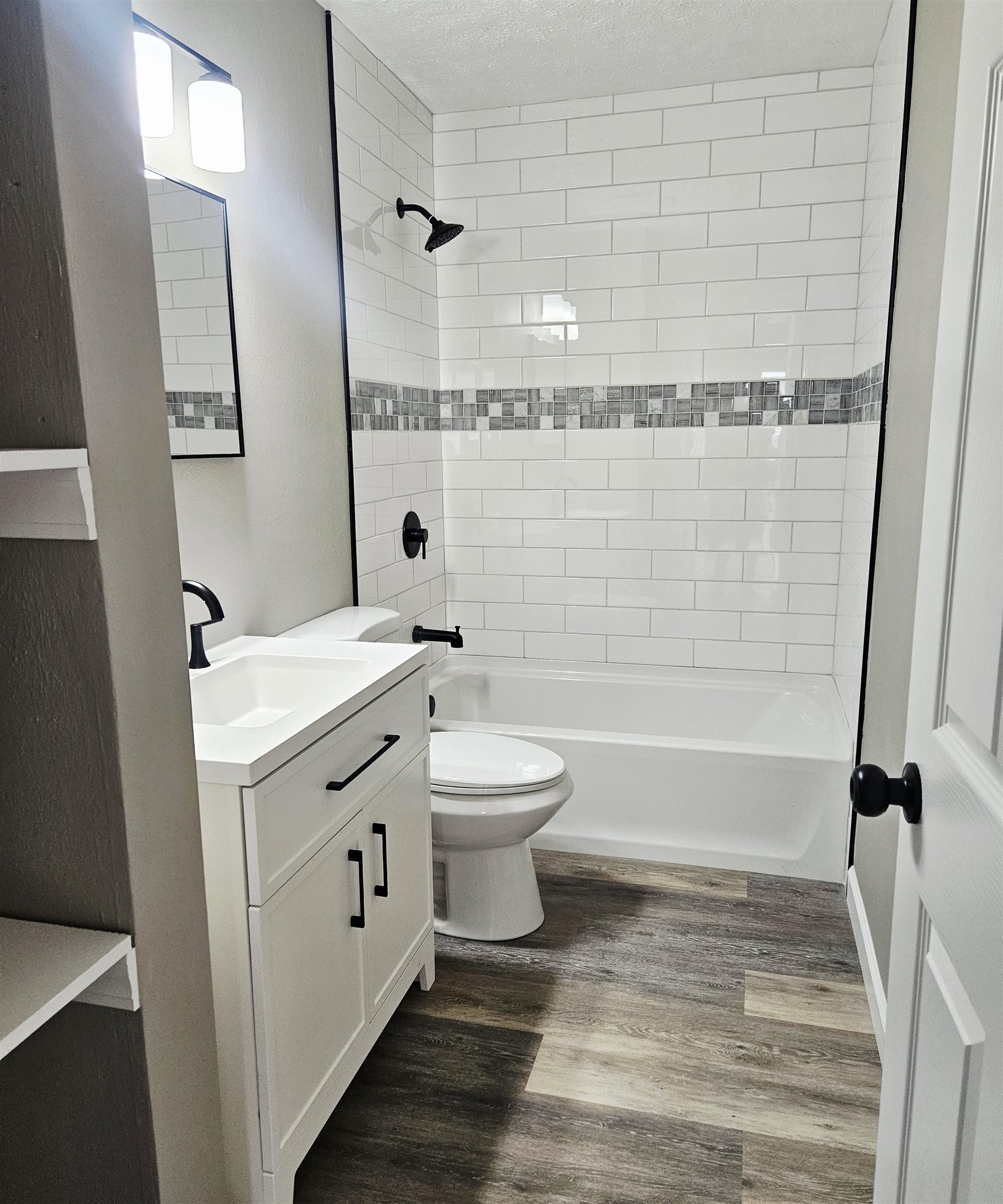 3216 North Winnebago Street Rockford, IL 61103 - Photo 11 of 18 a bathroom with a sink a toilet and shower