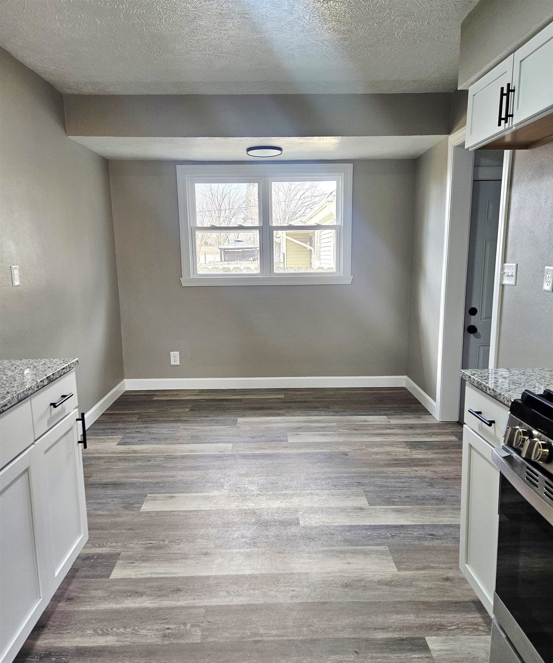 3216 North Winnebago Street Rockford, IL 61103 - Photo 12 of 18 a view of a kitchen with a sink a refrigerator and window
