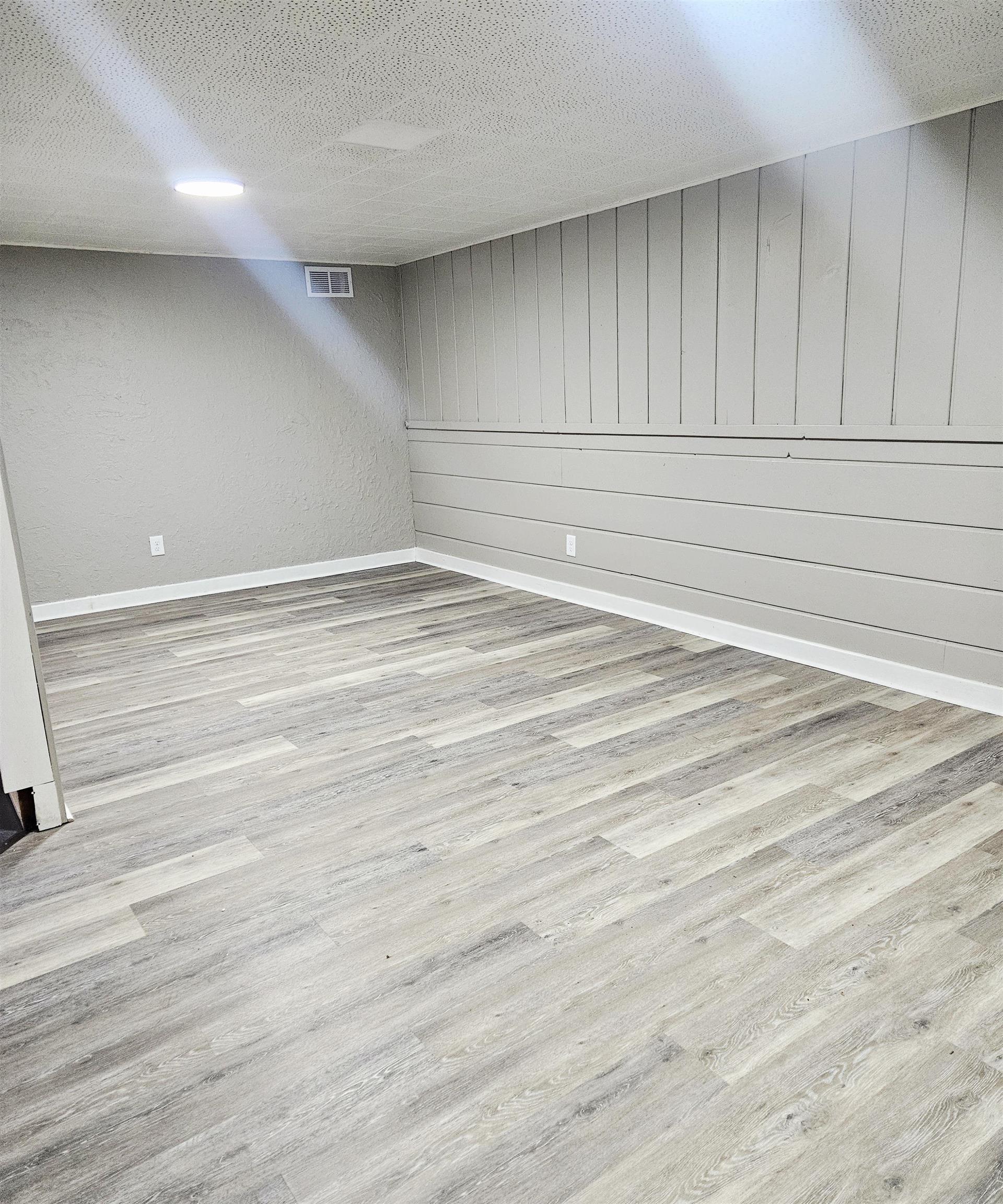3216 North Winnebago Street Rockford, IL 61103 - Photo 17 of 18 an empty room with wooden floor