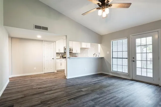 a living room with furniture fireplace and flat screen tv