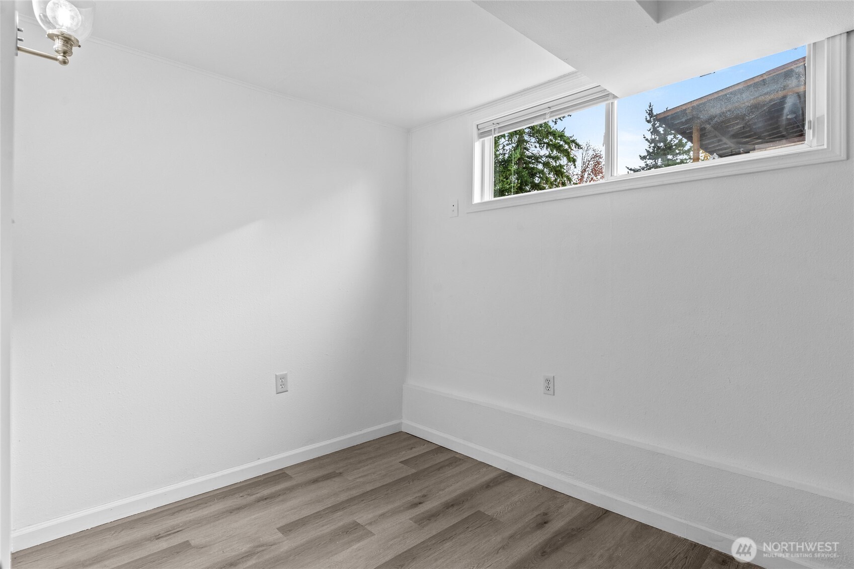 12703 Southeast 163rd Street Renton, WA 98058 - Photo 15 of 21 a view of small space with wooden floor and window