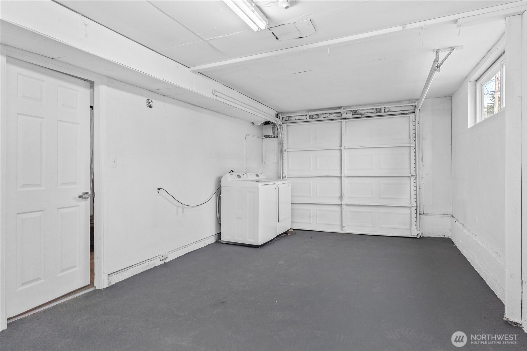 12703 Southeast 163rd Street Renton, WA 98058 - Photo 17 of 21 a view of a room with racks on the wall