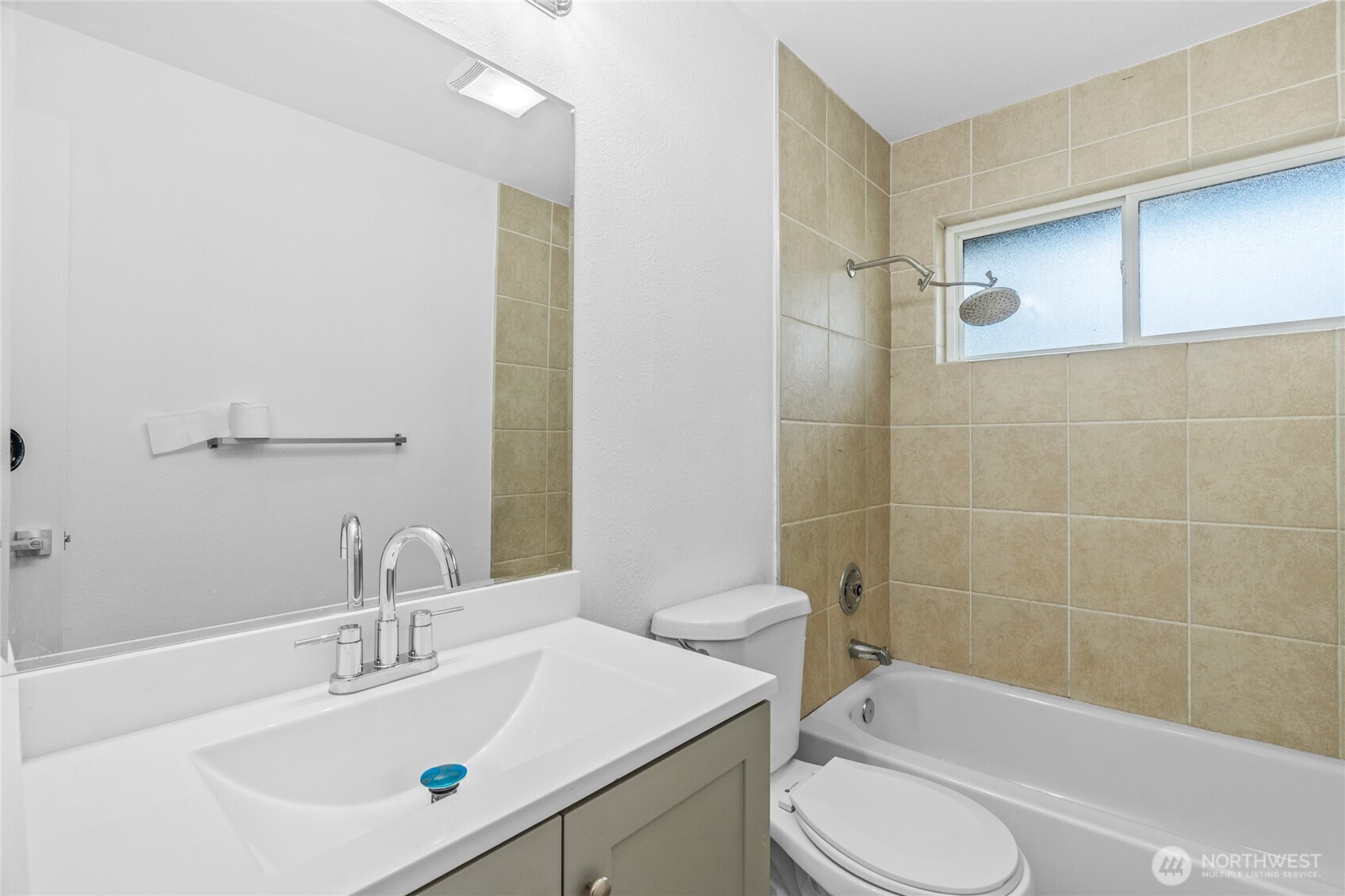 12703 Southeast 163rd Street Renton, WA 98058 - Photo 10 of 21 a bathroom with a sink toilet and shower