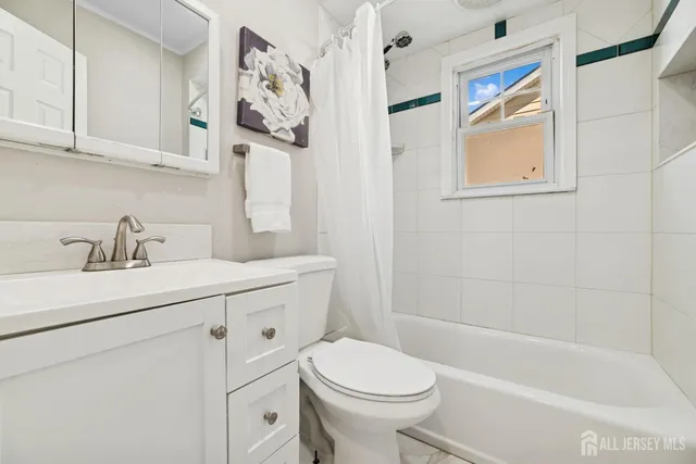 a bathroom with a sink a toilet and a bathtub