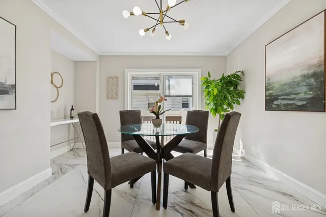 a view of a dining room with furniture and window