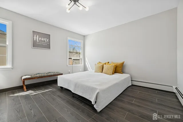 a bedroom with a bed and a desk