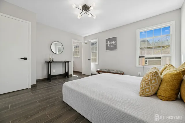 a bedroom with a bed and closet