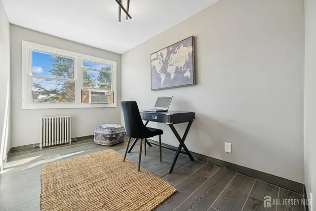 a work room with furniture and a window