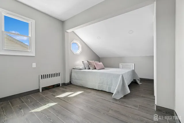 a bed room with a bed and a window