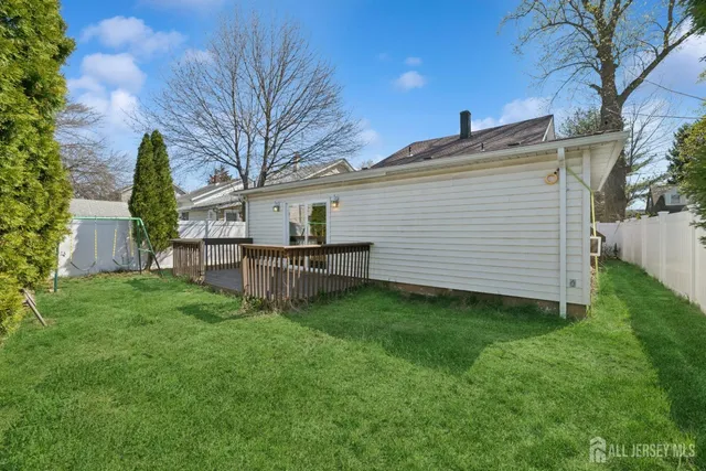 a view of backyard with a garden and entertaining space