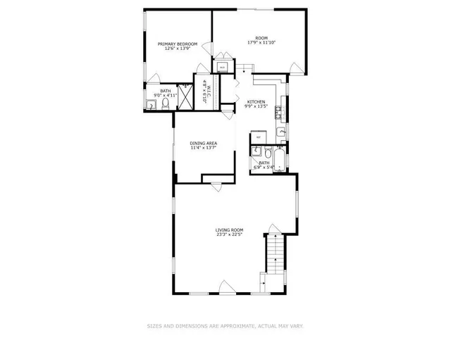 a picture of a bathroom with a white wall