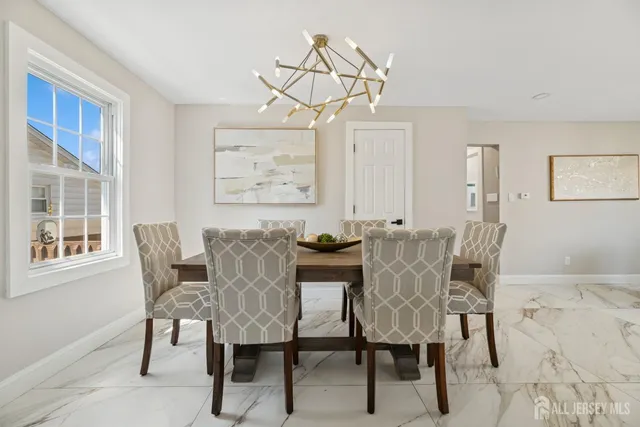 a view of a dining room with furniture window and outside view