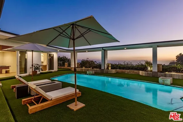 a view of a backyard with a patio