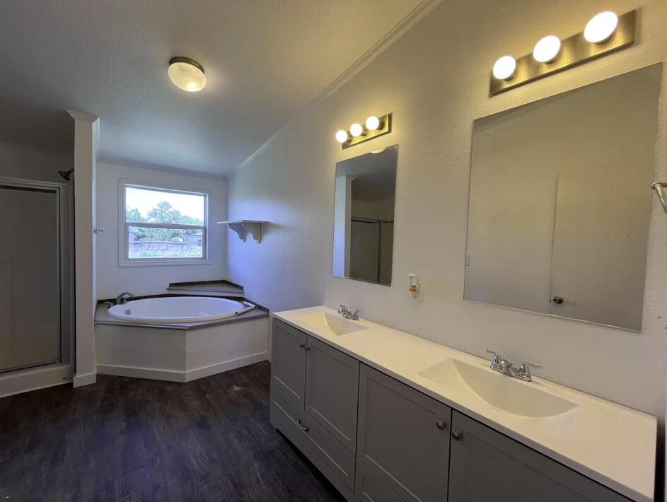 107 Grant Street Smyer, TX 79367 - Photo 15 of 22 a bathroom with a sink a toilet and mirror