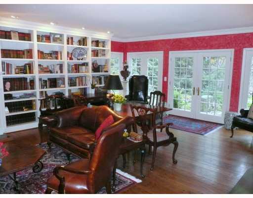 217 Dilworth Road Bell Acres, PA 15143 - Photo 7 of 17 Den/Family/Great Room. Pella architectural series French doors & windows cover the back wall & return of the room. A large fireplace with green marble, heavy dart & egg molding & random-width plank flooring complete the room.