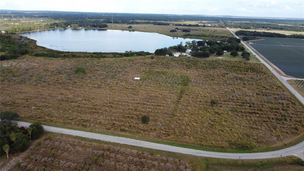 7630 Lake Buffum Road North Lake Wales, FL 33859 - Photo 10 of 14 a view of a lake from a yard