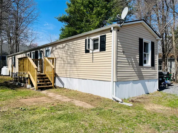 a view of a backyard with a small cabin