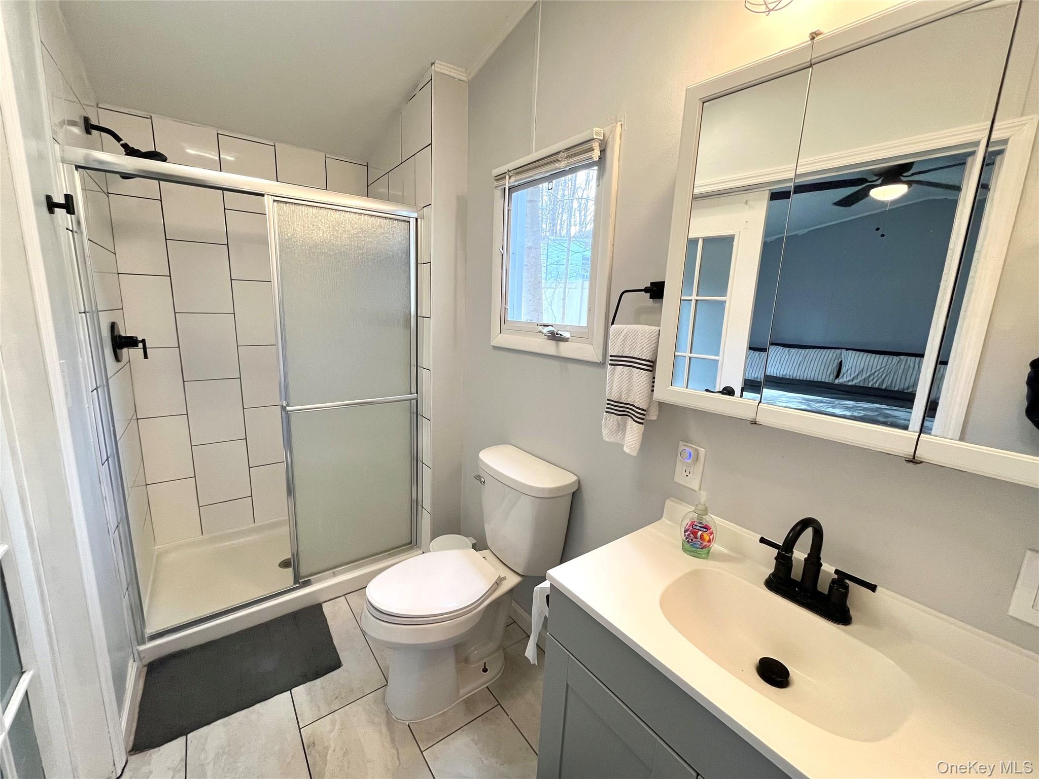 723 Beekman Road, Unit 42 Hopewell Junction, NY 12533 - Photo 11 of 16 a bathroom with a sink toilet and shower