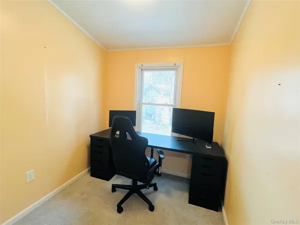 a view of livingroom with furniture and windows